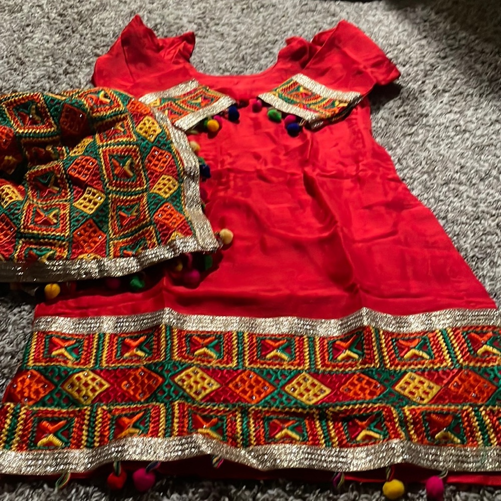 Pulkari blood red suit with dupatta. The one or two Pom Pom  came off,